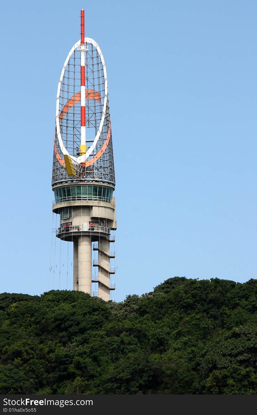 A Photo of a control tower directing traffic in a harbour. A Photo of a control tower directing traffic in a harbour