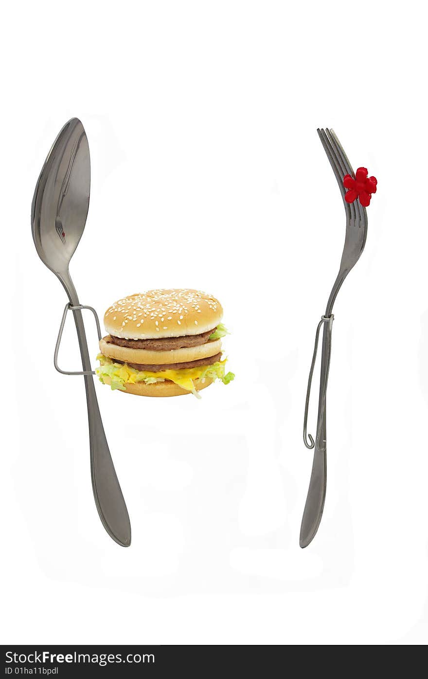 Spoon and fork on a white background. Burger. Spoon and fork on a white background. Burger.