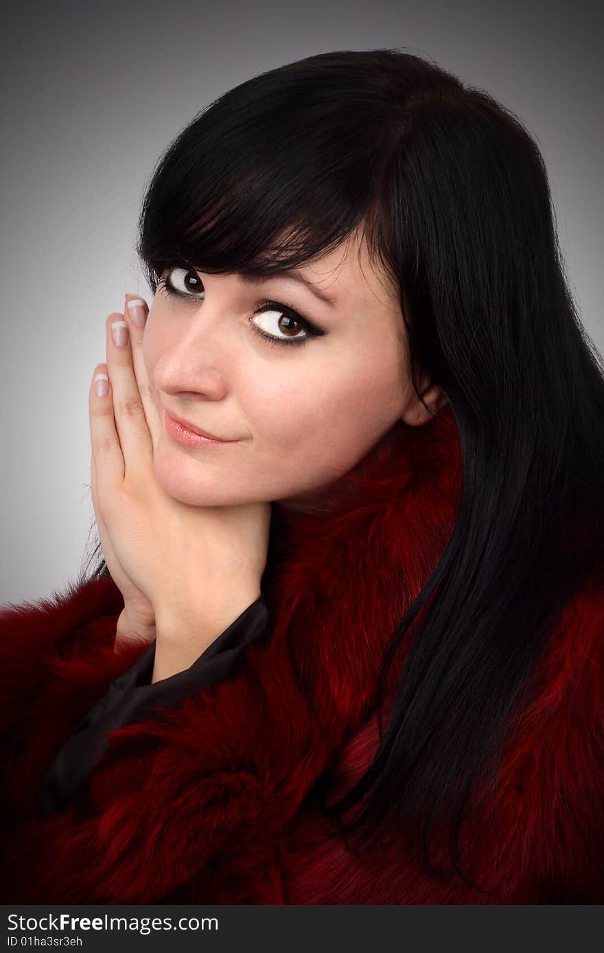 Brunette Is In A Red Fur Coat