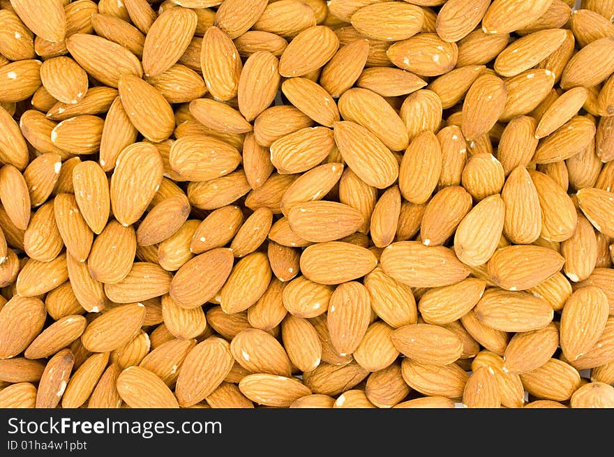 Crude almonds laying as a back background