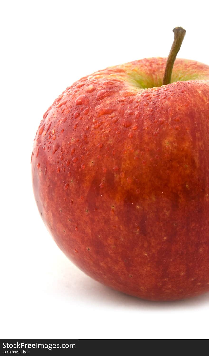 Red apple with drop isolated on white