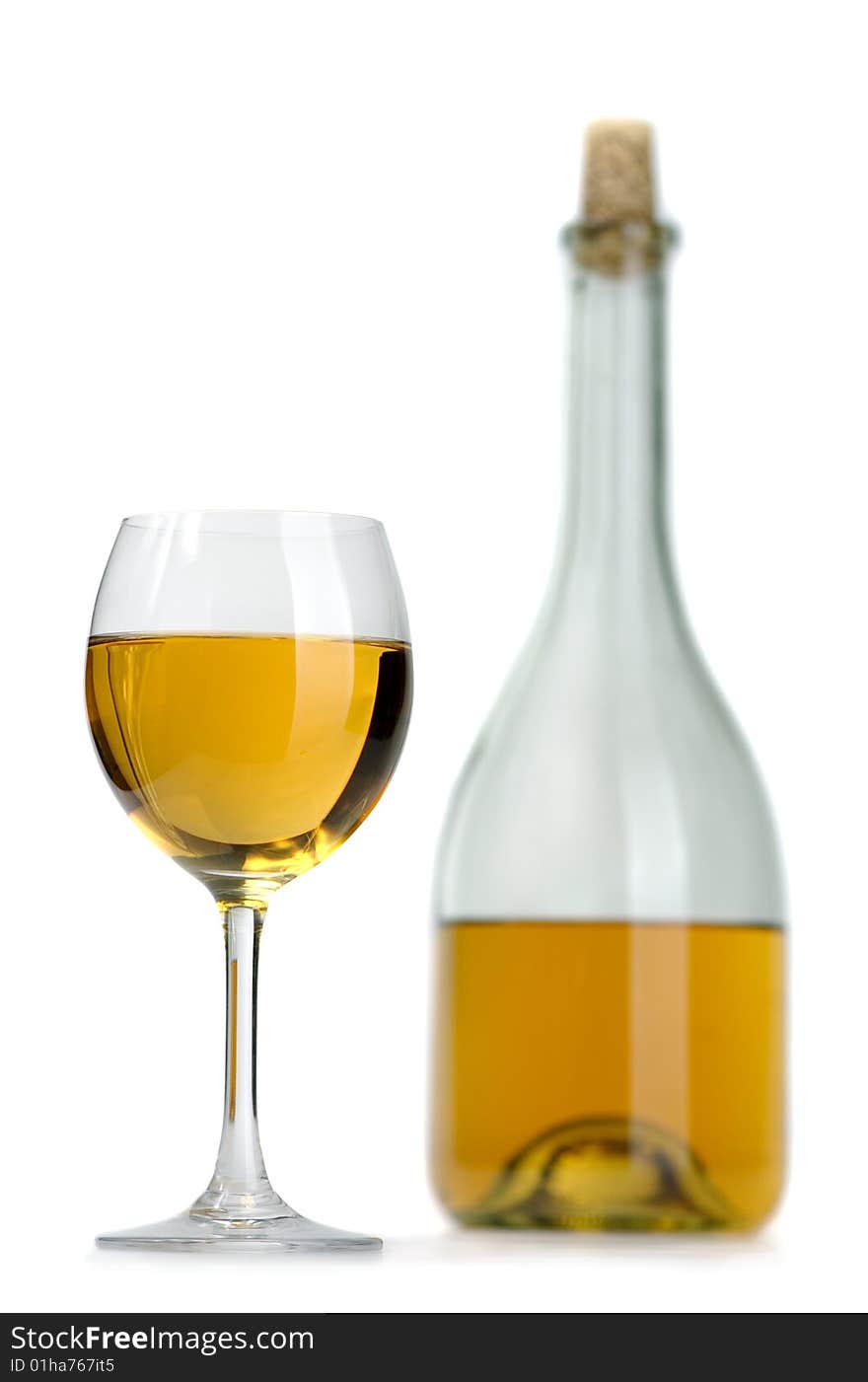 Glass and bottle of excellent white wine on a white background