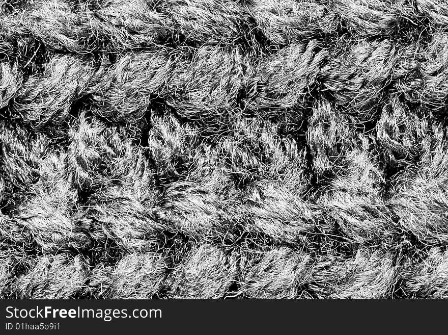 A close-up of the texture of grey woolen fabric. A close-up of the texture of grey woolen fabric