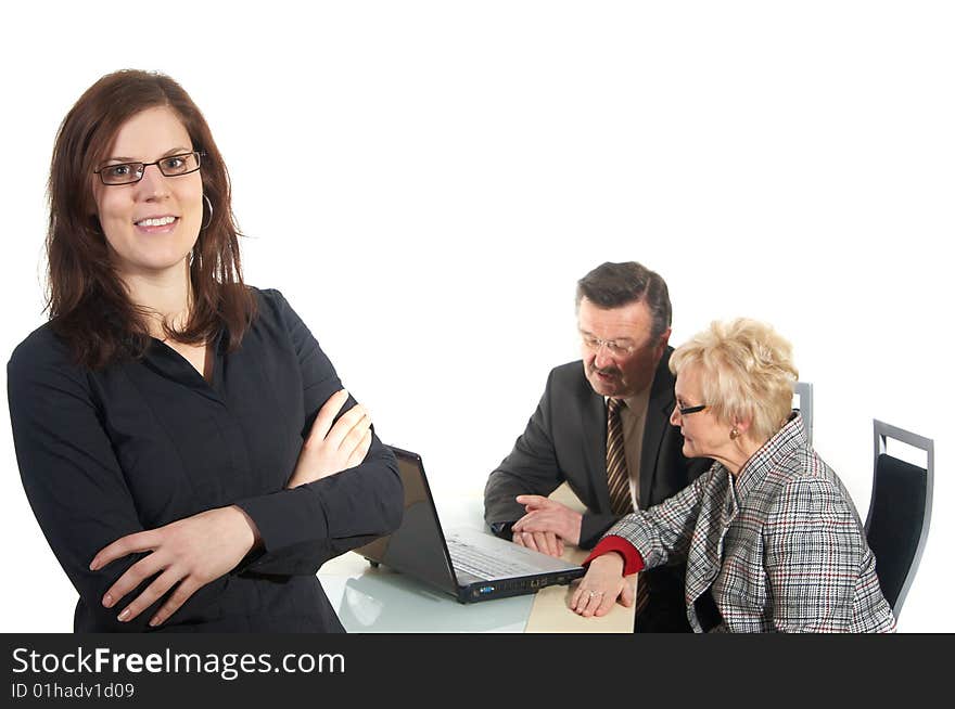 Businesswoman in office environment. Three people with focus on young woman in front. Isolated over white.