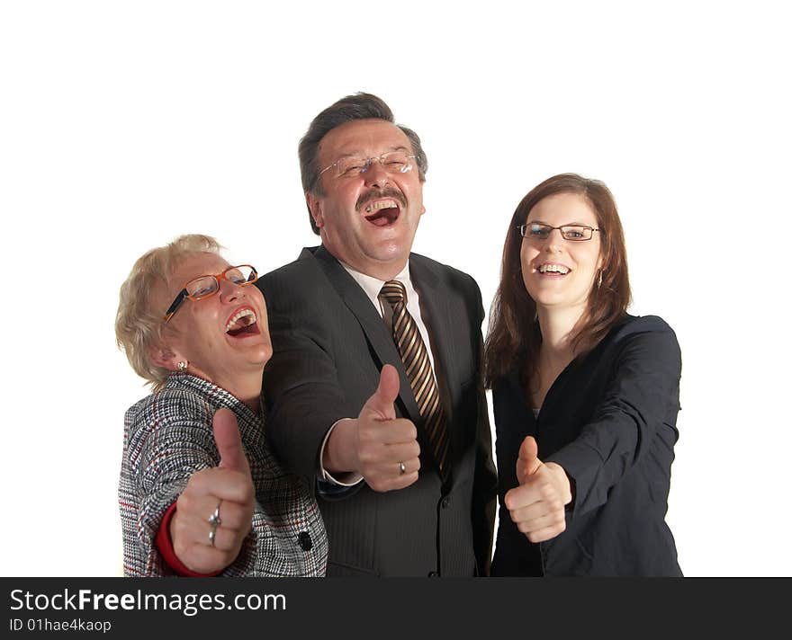 Senior business team with a young female worker giving thumbs up sign! They are all laughing hard!. Senior business team with a young female worker giving thumbs up sign! They are all laughing hard!