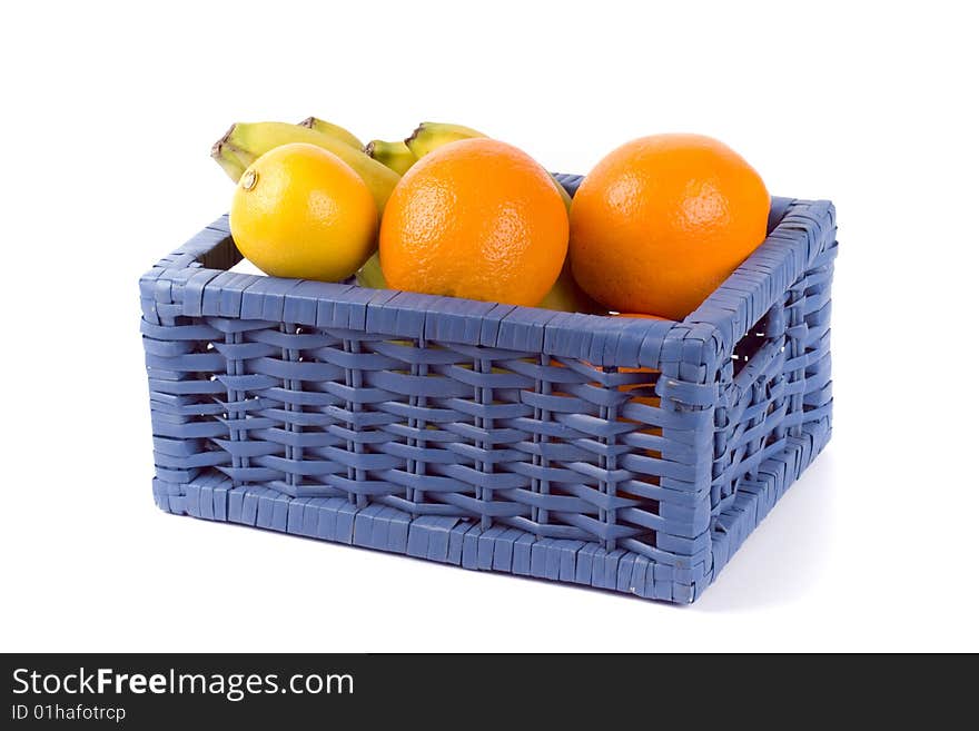 Blue basket with fruits on white background