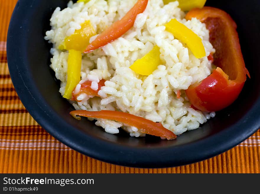 Italian rice with yellow and red peppers. Italian rice with yellow and red peppers