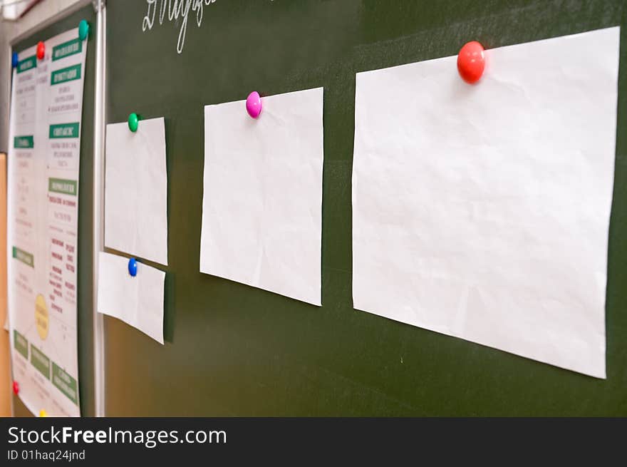 Paper sheets on a board.