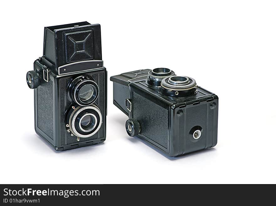 Two old photo cameras on white background