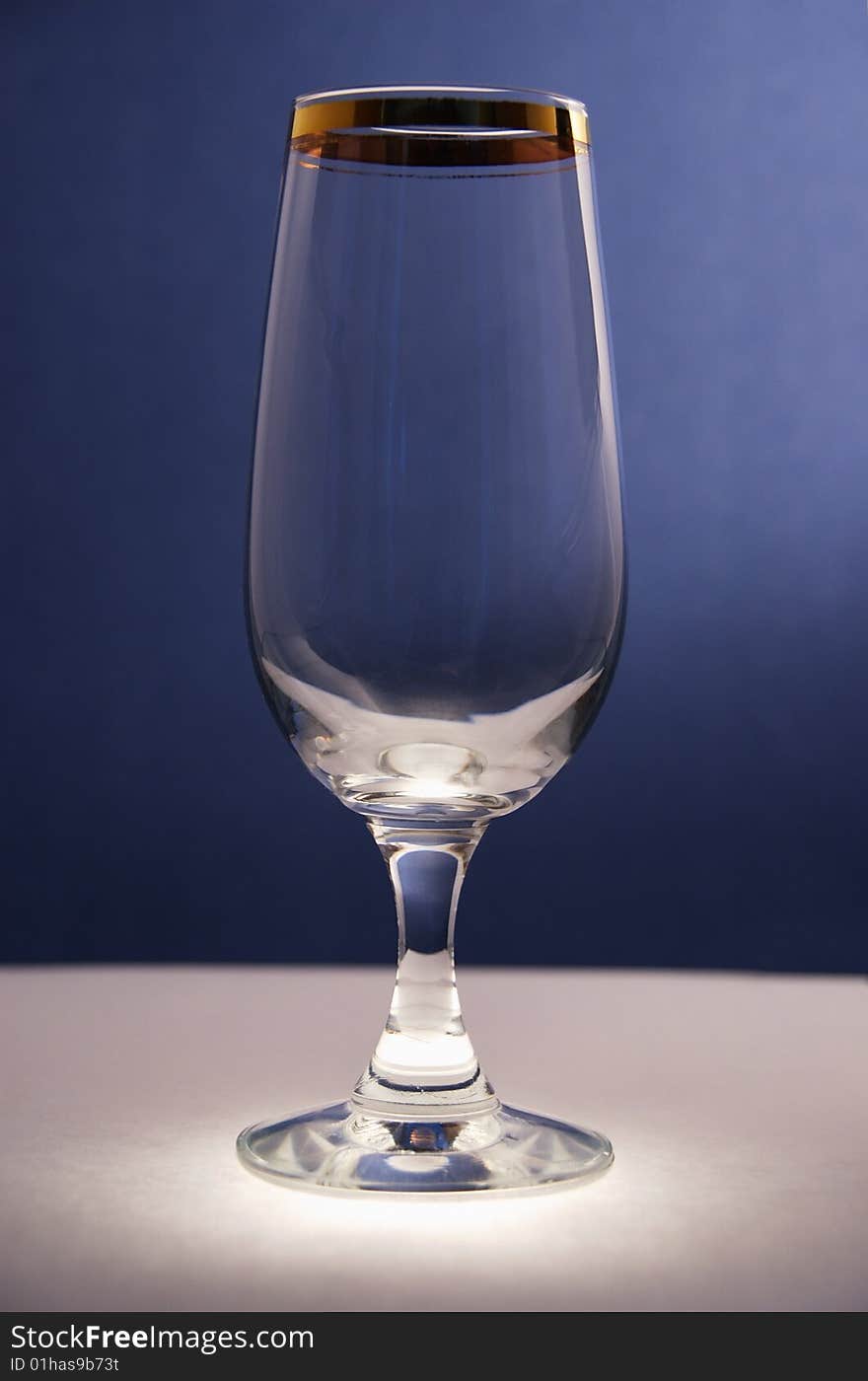 Champagne glass on dark blue background