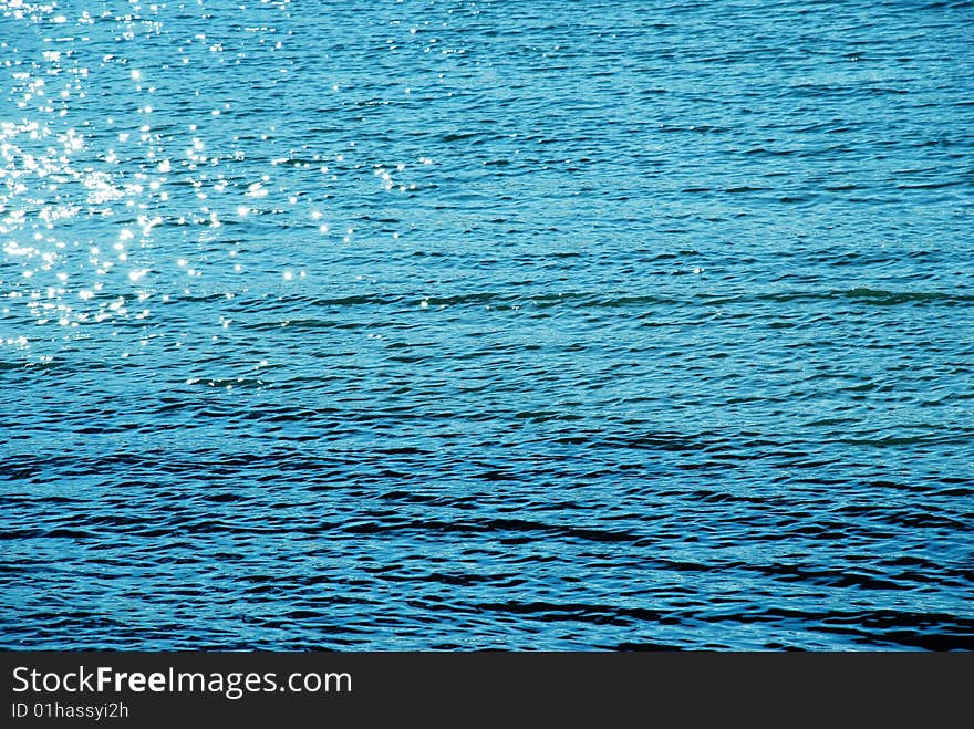 Blue sunny water natural surface. Blue sunny water natural surface