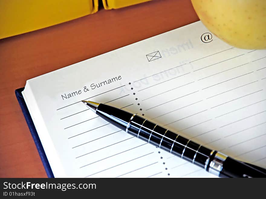 Organizer with metallic black pen on desk