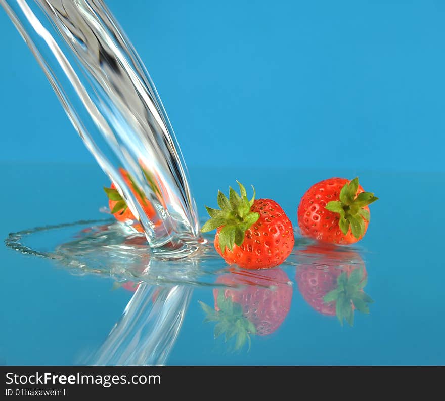 Blue background of water and Strawberry