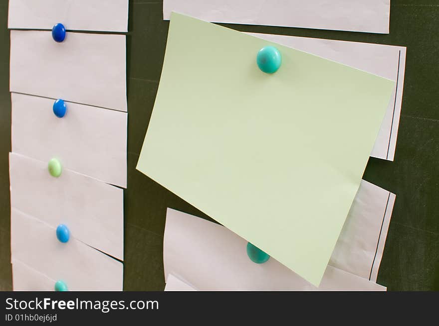 Paper sheets on a board.