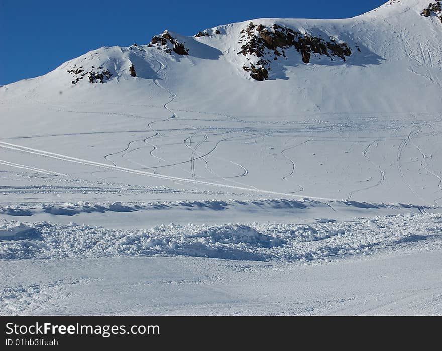 Ski trails on snowed mountain peak in Stubai resort, Austria