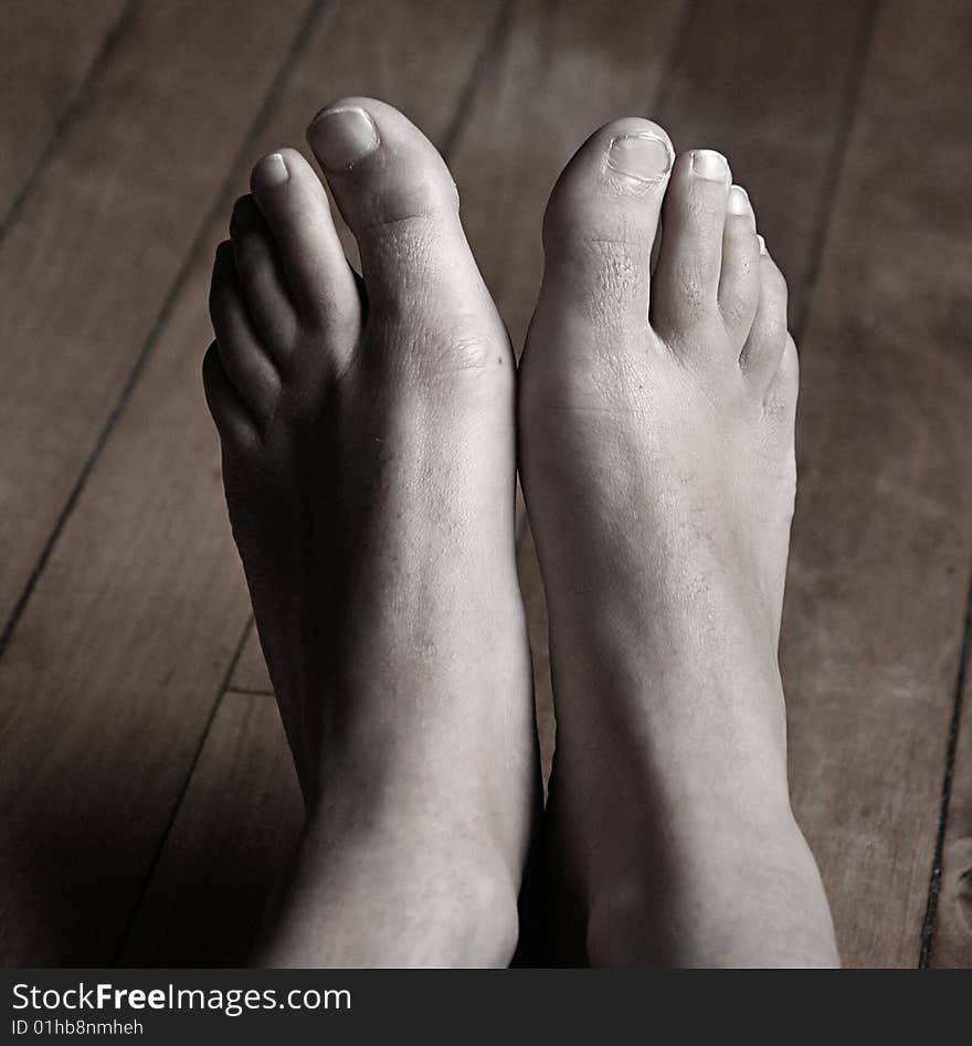 An image of woman's  feet in sepia tone