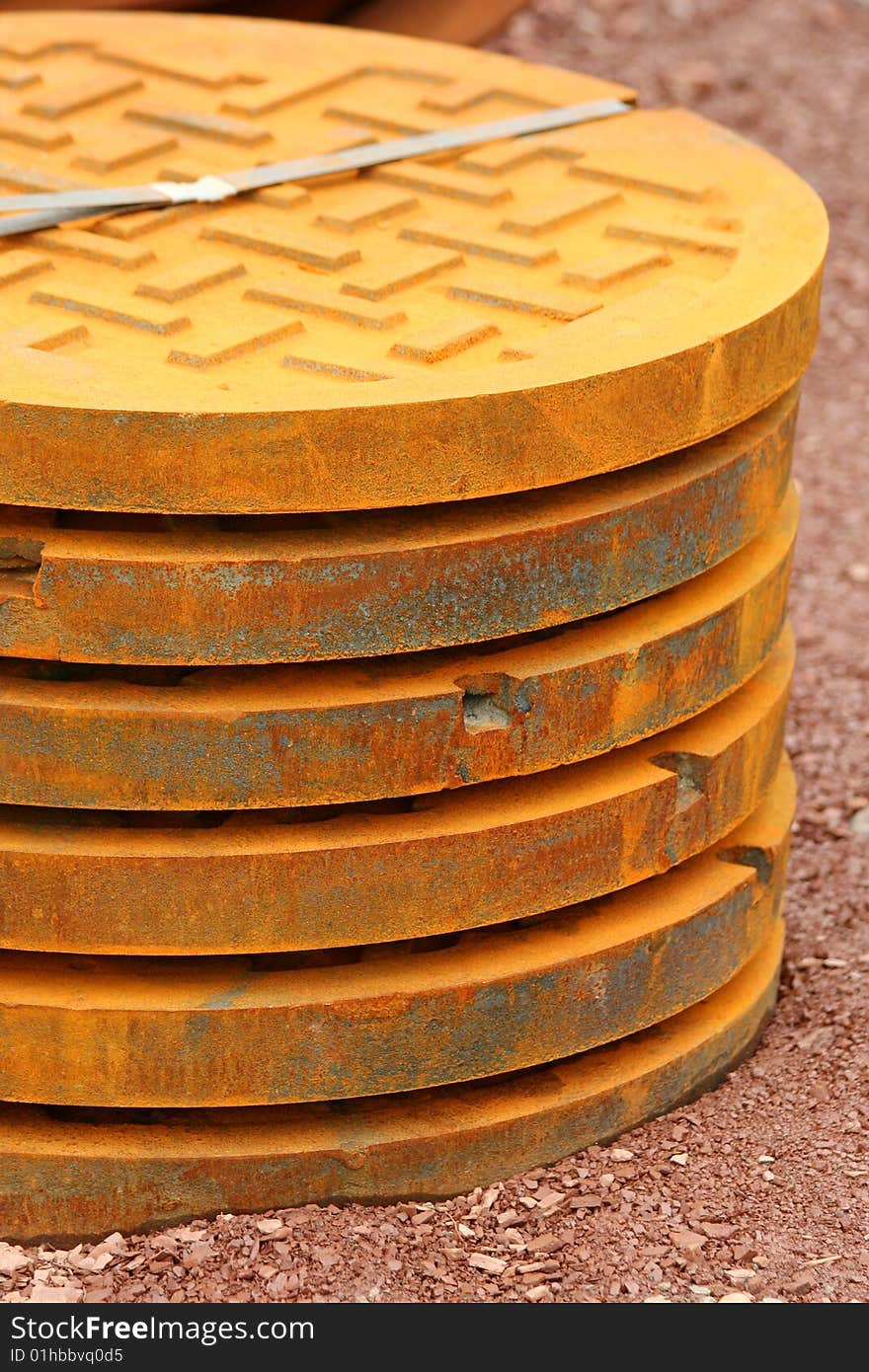 A stack of manhole covers