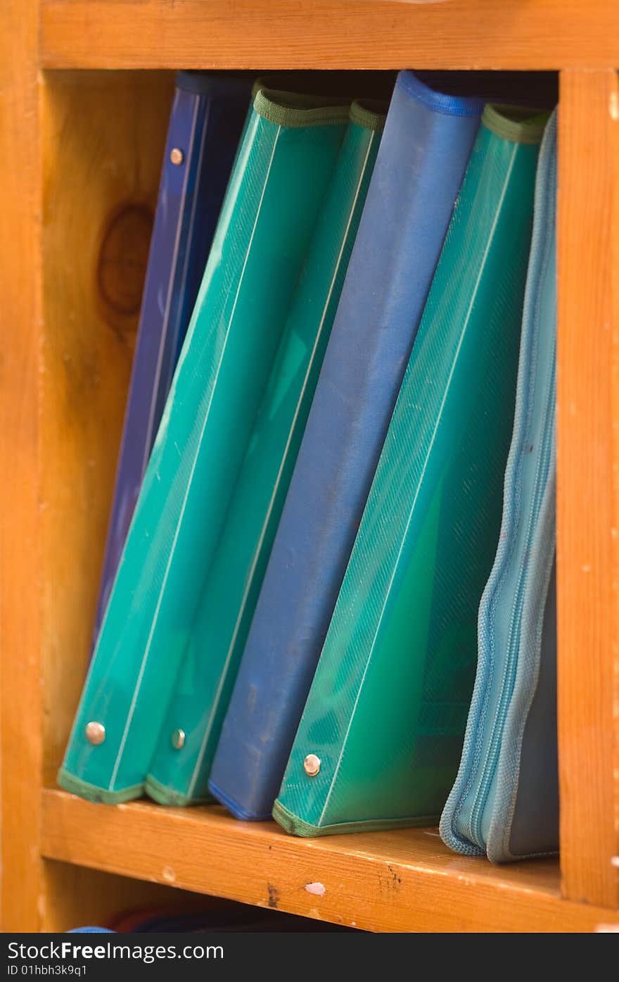 Folders With Papers On A Shelf.