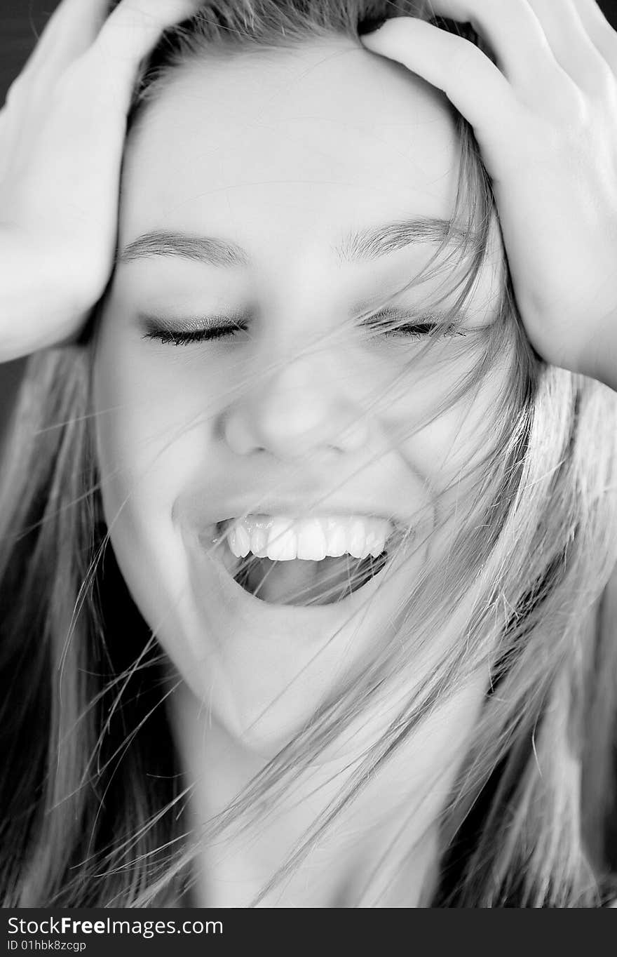 Bright bw closeup portrait of happy girl face holding your head. Bright bw closeup portrait of happy girl face holding your head