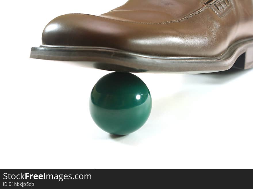 Shoes on a white background and green ball