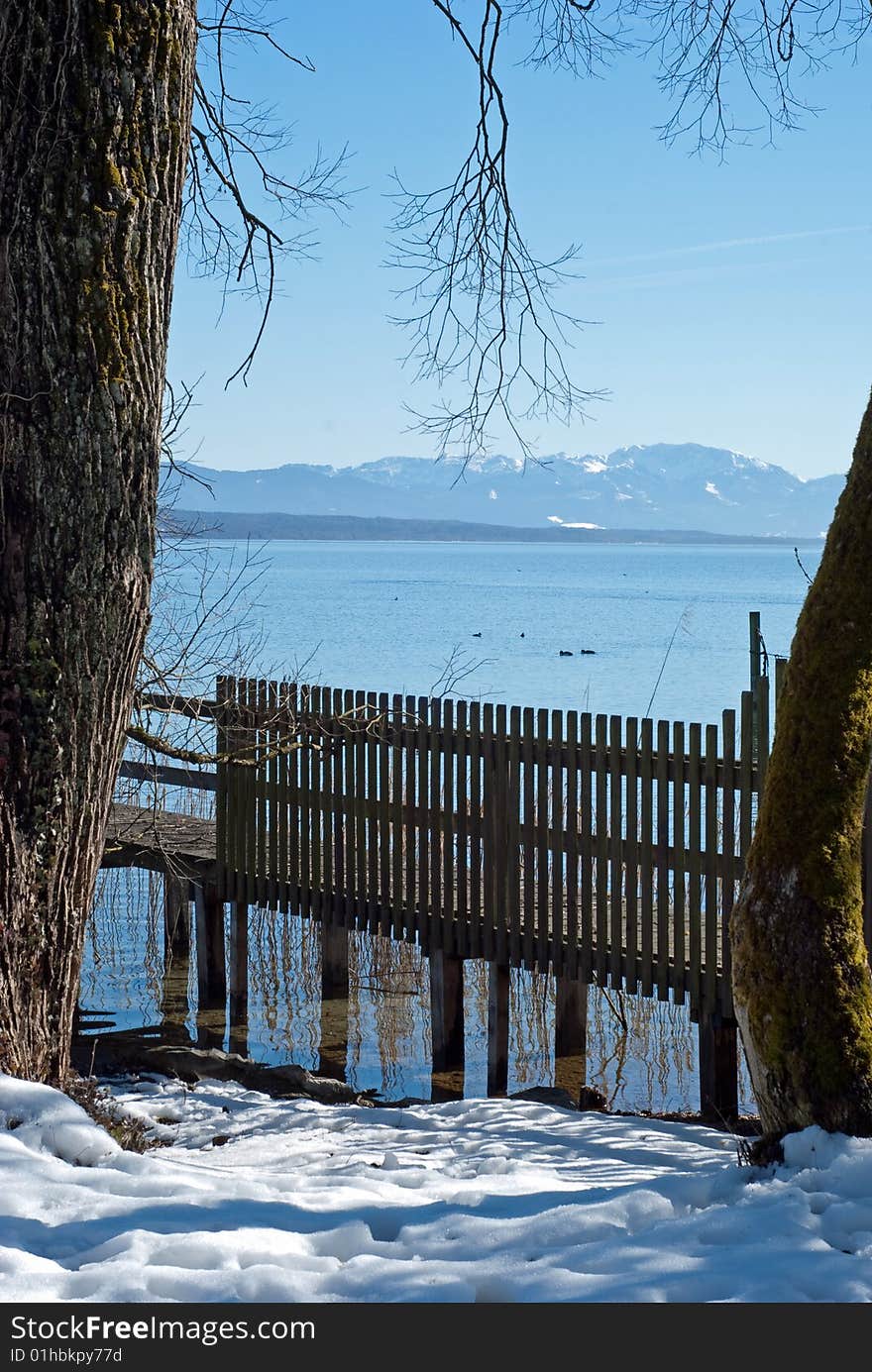 Lake Starnberger See in Bavaria, Germany. The mountain range in the background are the European Alps. The picture was taken on a beautiful winter day.