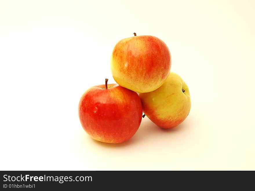 Three apples on a white background