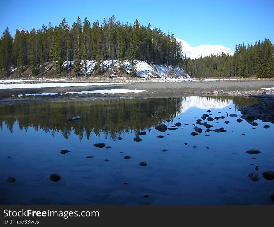 Reflection off a lake in Jasper National Park in Alberta. Reflection off a lake in Jasper National Park in Alberta.