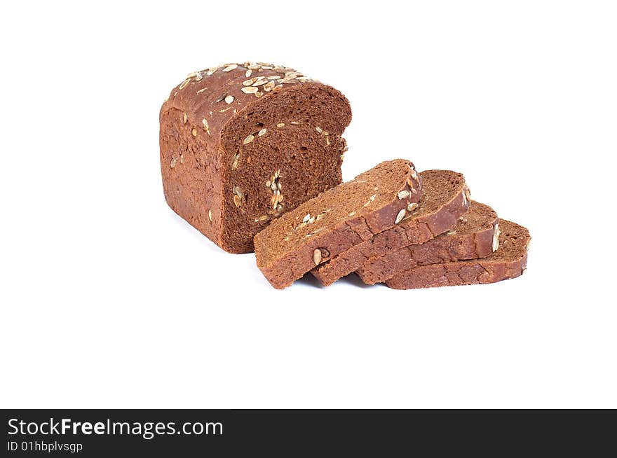 Rye bread full of seeds isolated on a white background. Rye bread full of seeds isolated on a white background.