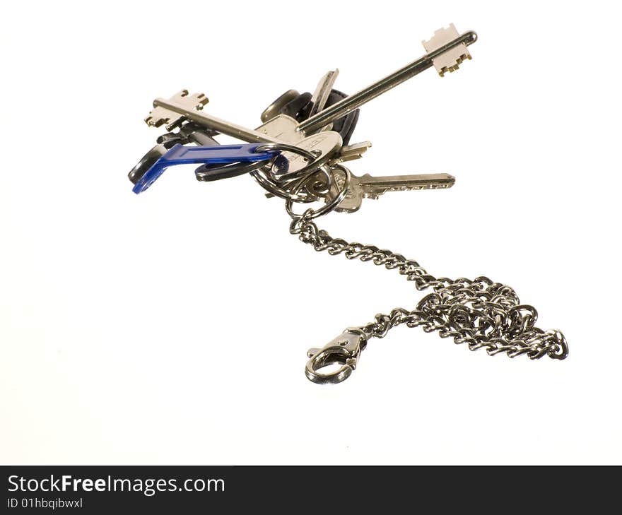 The keys and money on a white background. The keys and money on a white background