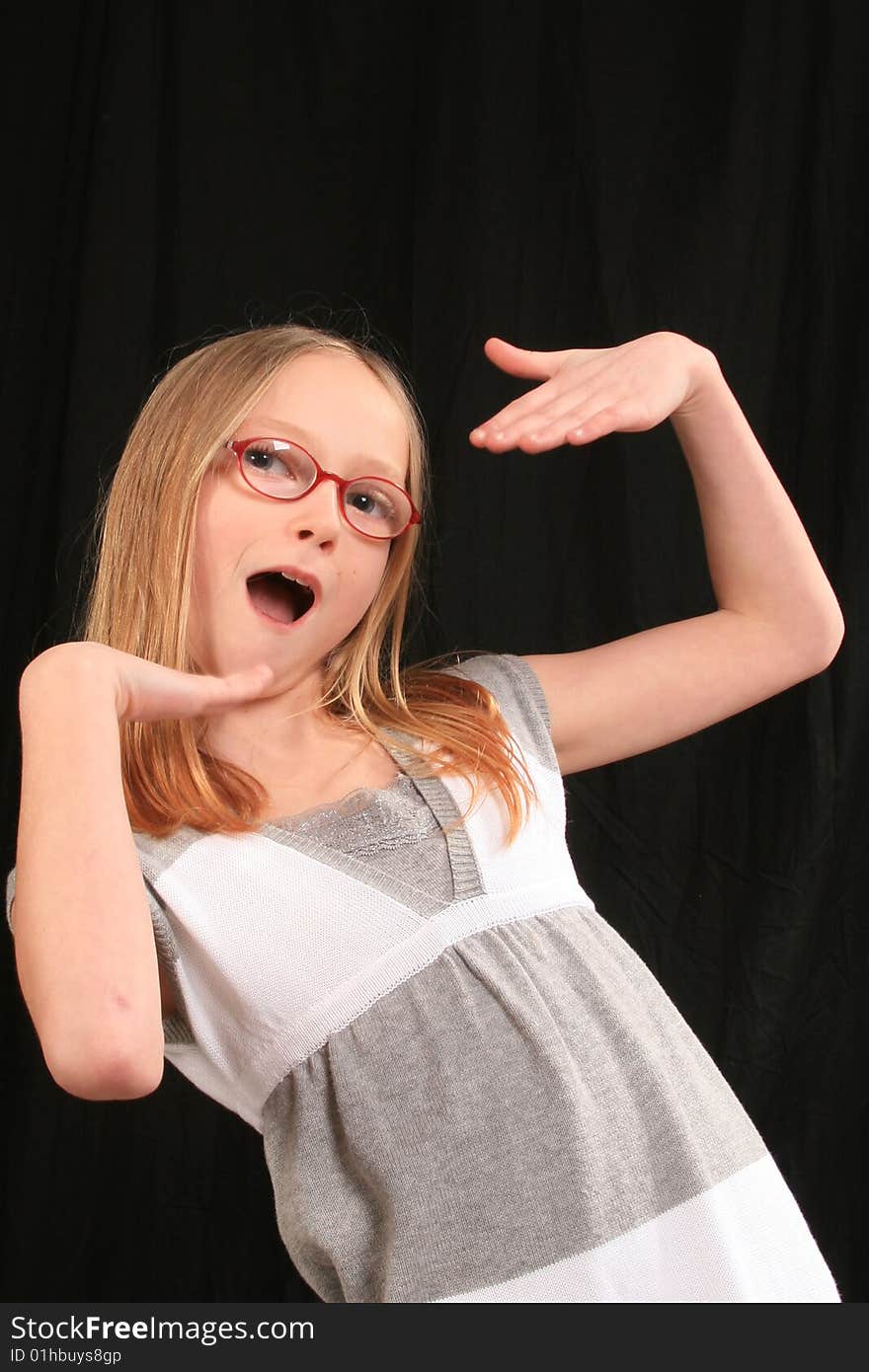 Blonde girl wearing glasses with a crazy expression. Blonde girl wearing glasses with a crazy expression