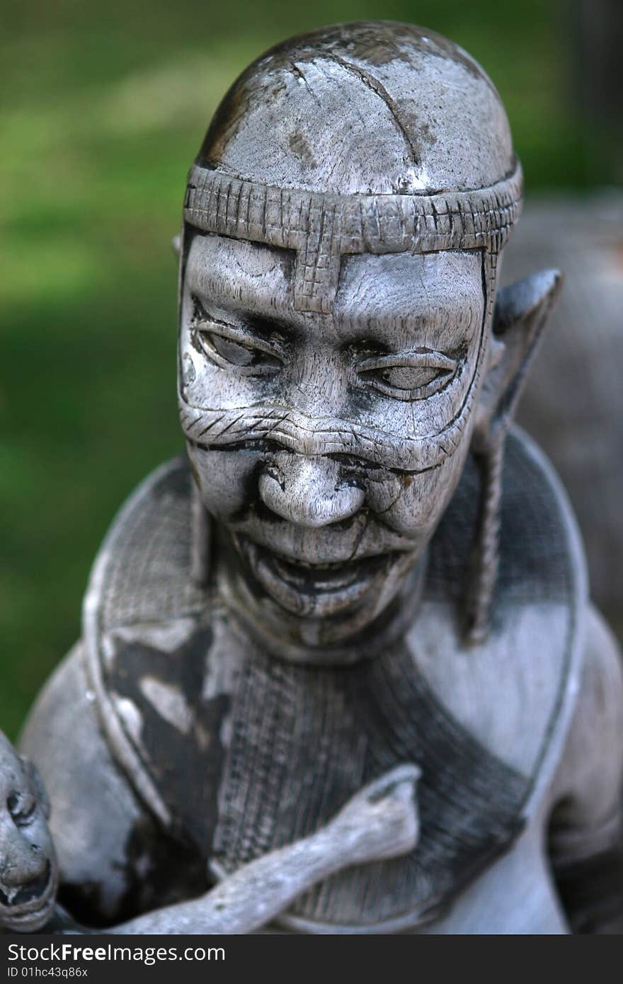 African wooden sculpture in day light. African wooden sculpture in day light