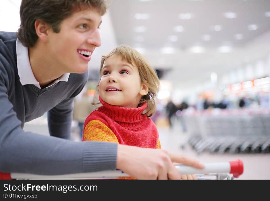 Father and daughter in shop