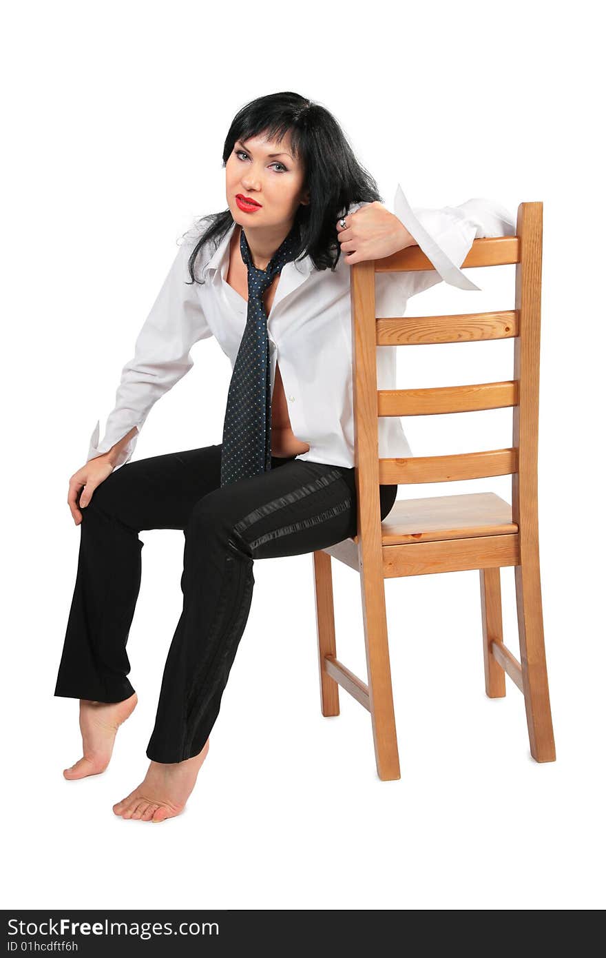 Tired brunette with necktie on chair on white