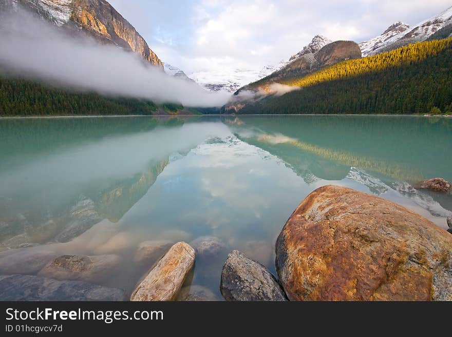 Lake Louise framed by the rocks and the distant mountains