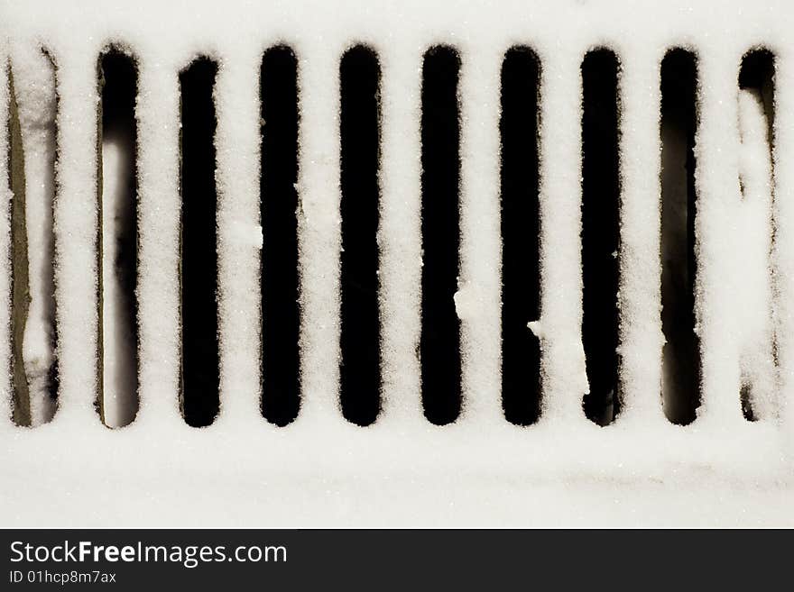 Storm drain cover in snow