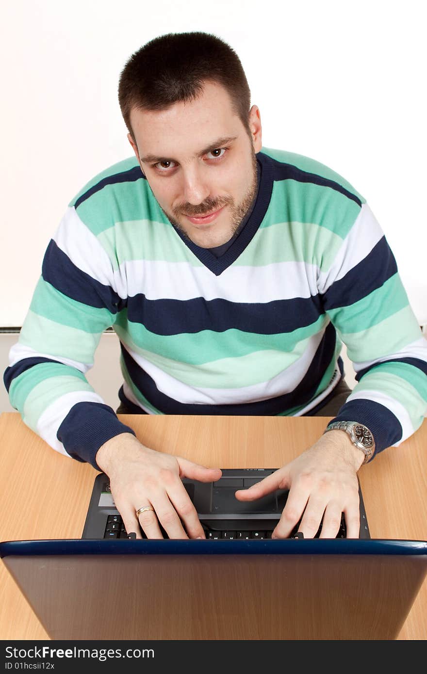 Young man working with his notebook. Young man working with his notebook