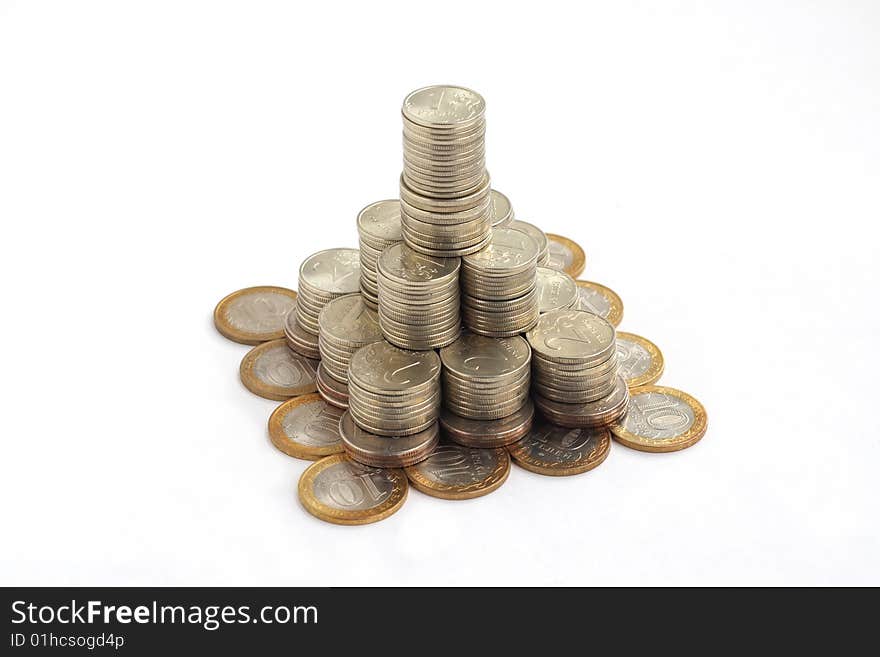 Pyramid of coins isolated on white background