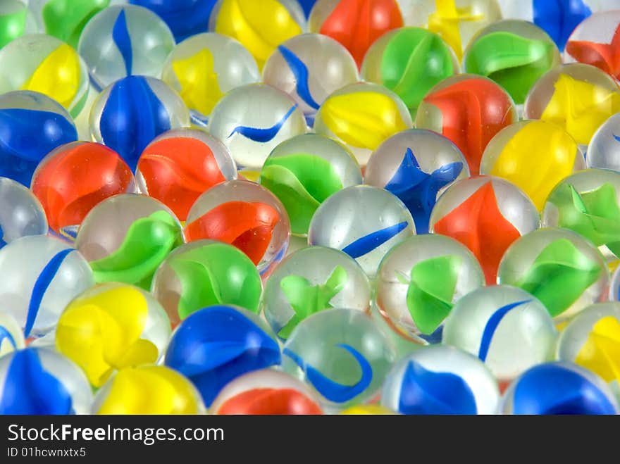 A close up of colorful glass marbles