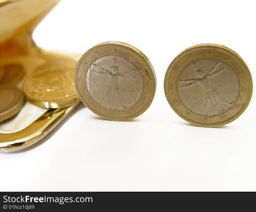 Two coins rolling into a purse. Two coins rolling into a purse