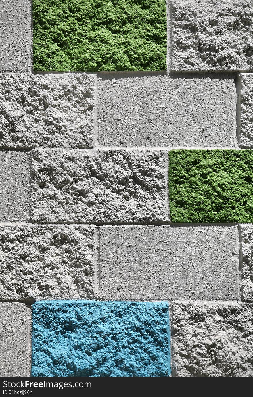 Multicolored white, green, and blue dayglo brick wall. Multicolored white, green, and blue dayglo brick wall