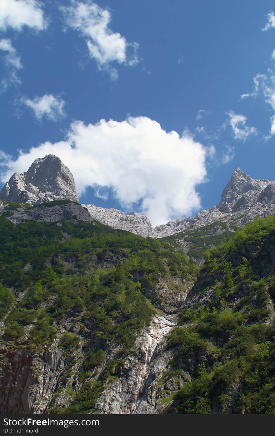 Scenery shot in Alpine mountains, two peaks and cloud. Scenery shot in Alpine mountains, two peaks and cloud