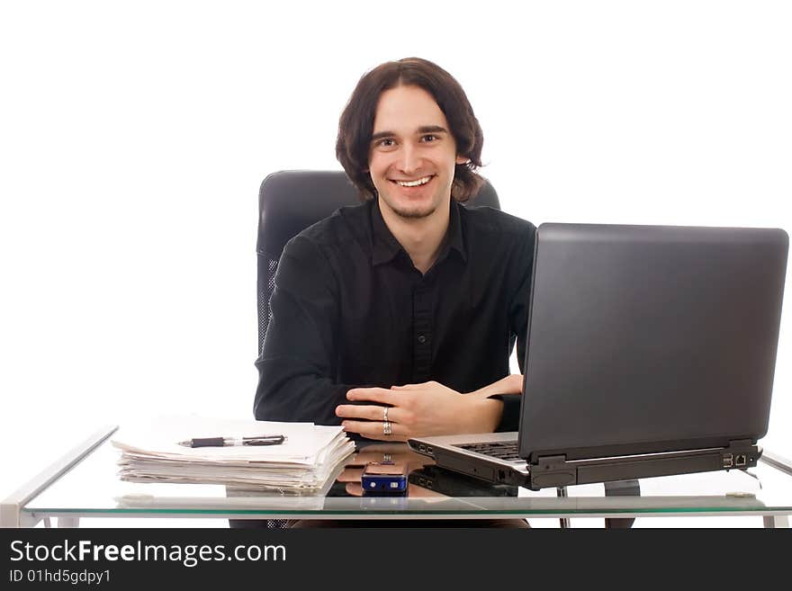 A youn man working in his office. A youn man working in his office