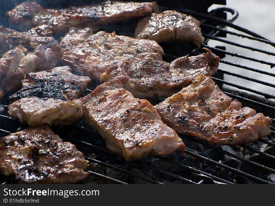 Delicious looking steaks cooking on the grill. Delicious looking steaks cooking on the grill
