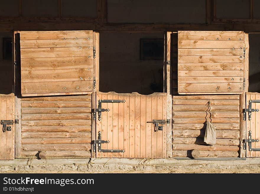 Opened outdoor wooden stable boxes. Opened outdoor wooden stable boxes