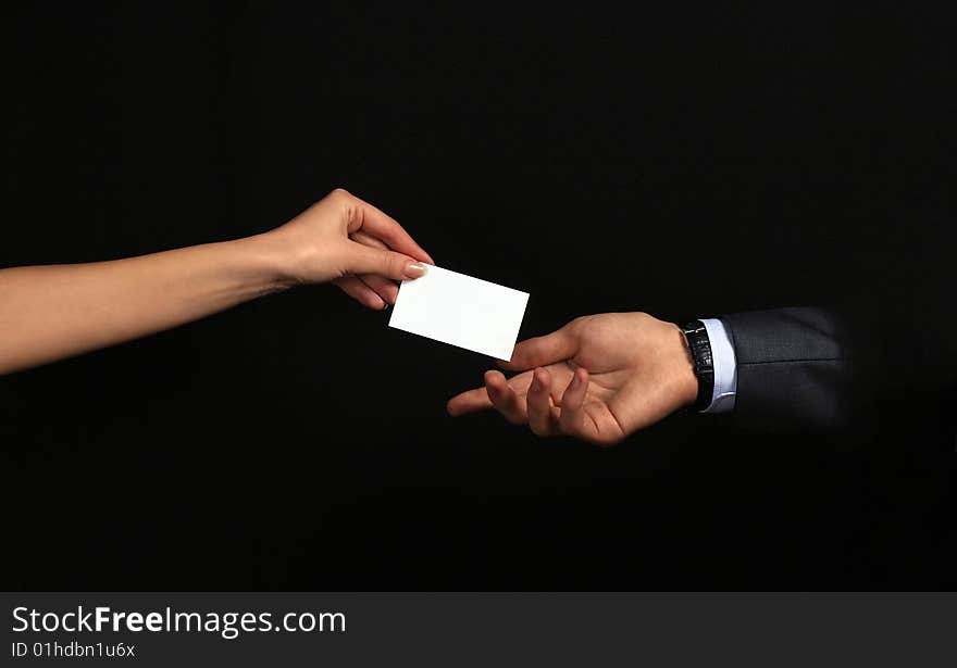 Businesswoman gives a card to businessman. Businesswoman gives a card to businessman