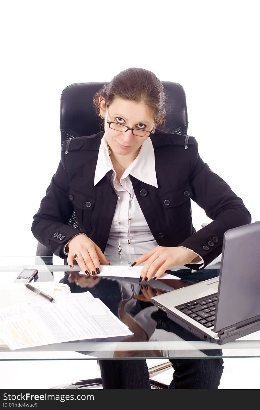 A young woman building a paper plane in her office