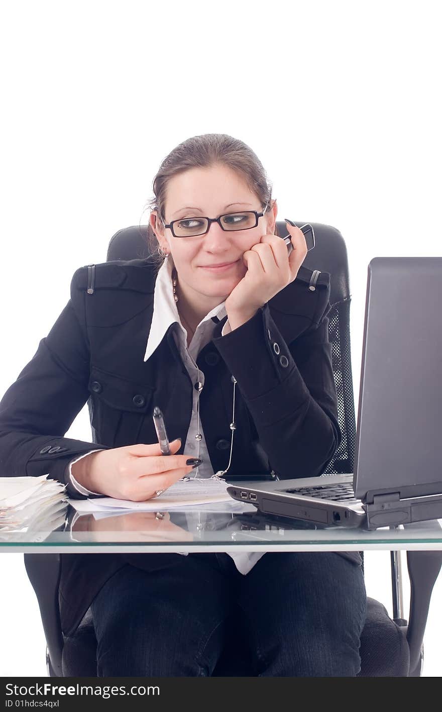 A bored young business woman in her office. A bored young business woman in her office