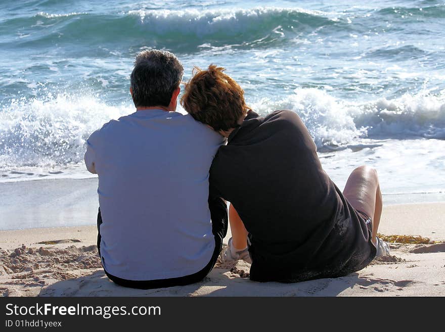 Couple sitting on the beach