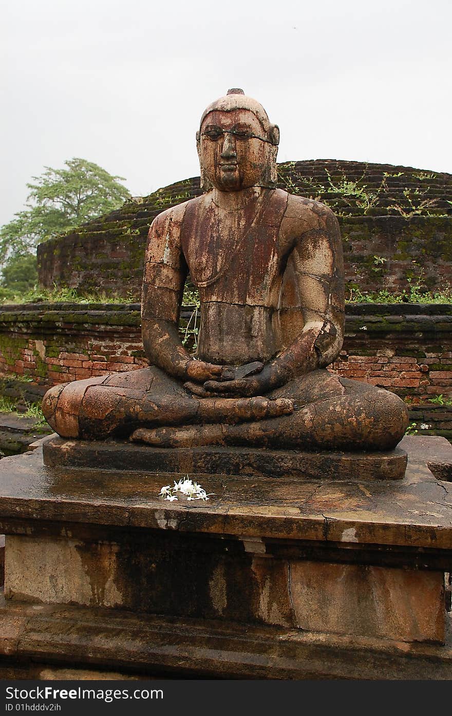 Four statues of seated Buddha are located in the Vatadage ancient house of relic in Polonnaruwa, Sri Lanka. One of them is shown in the picture. Four statues of seated Buddha are located in the Vatadage ancient house of relic in Polonnaruwa, Sri Lanka. One of them is shown in the picture.