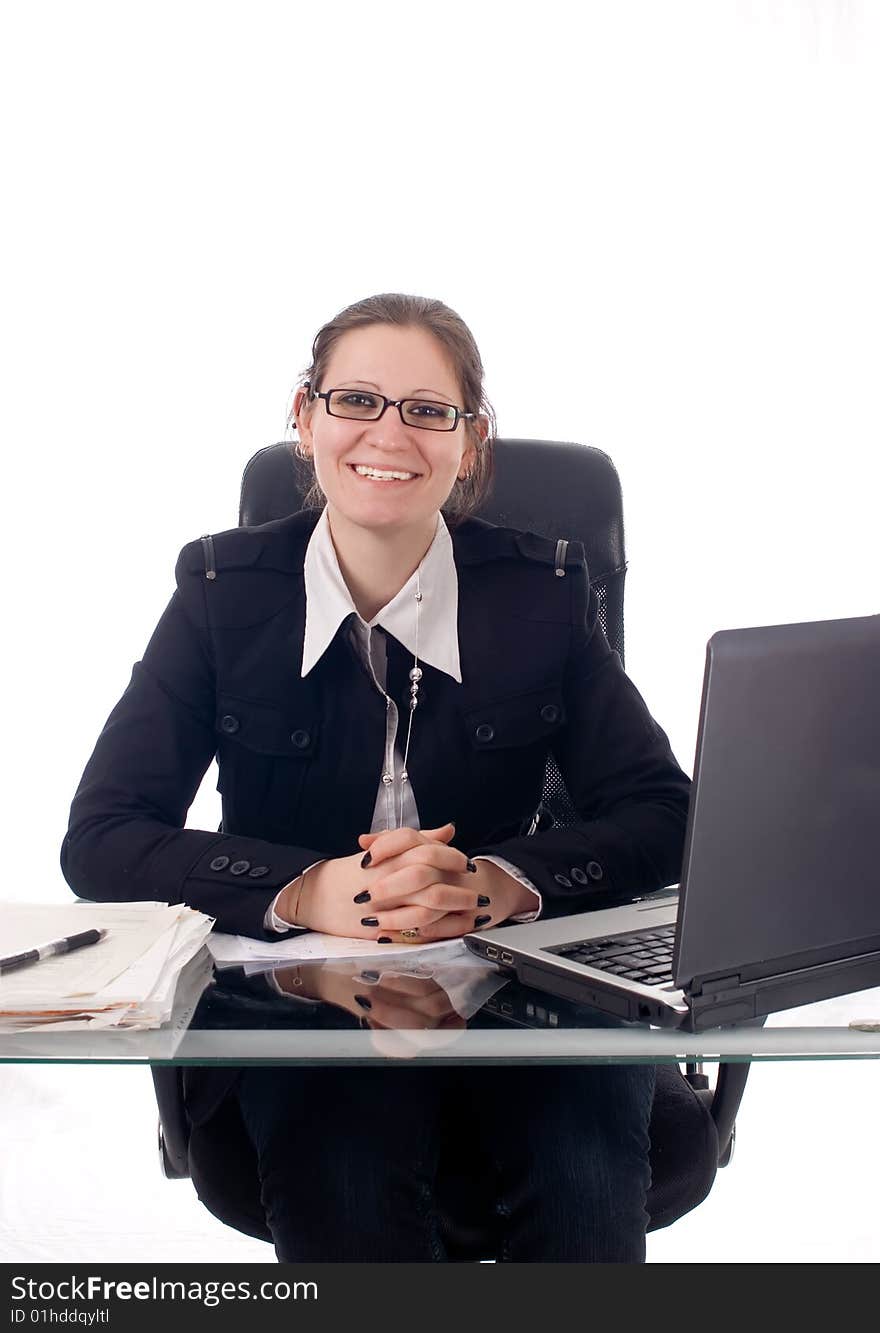 A young business woman working in her office. A young business woman working in her office